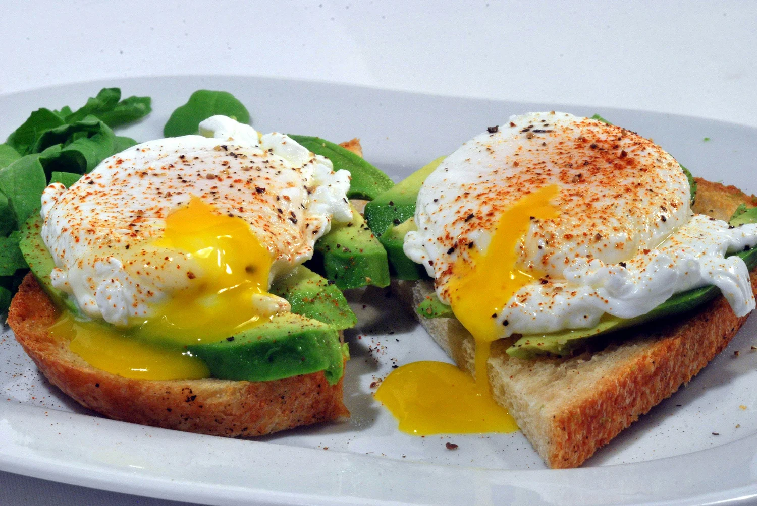 Poached eggs on toast with avocado