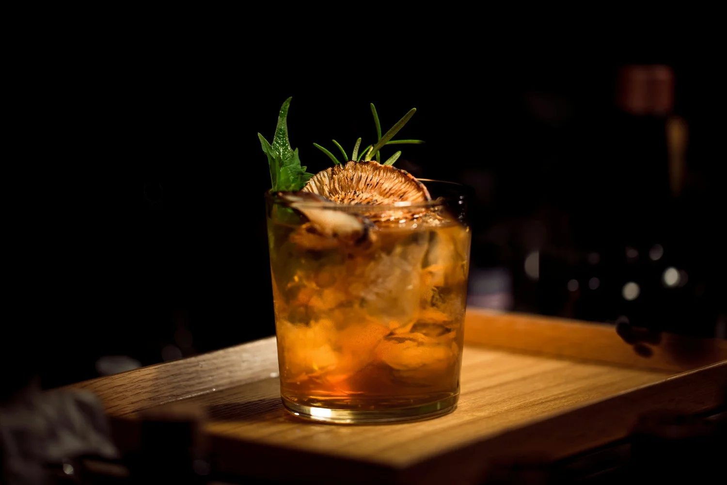 Rum cocktail garnished with rosemary