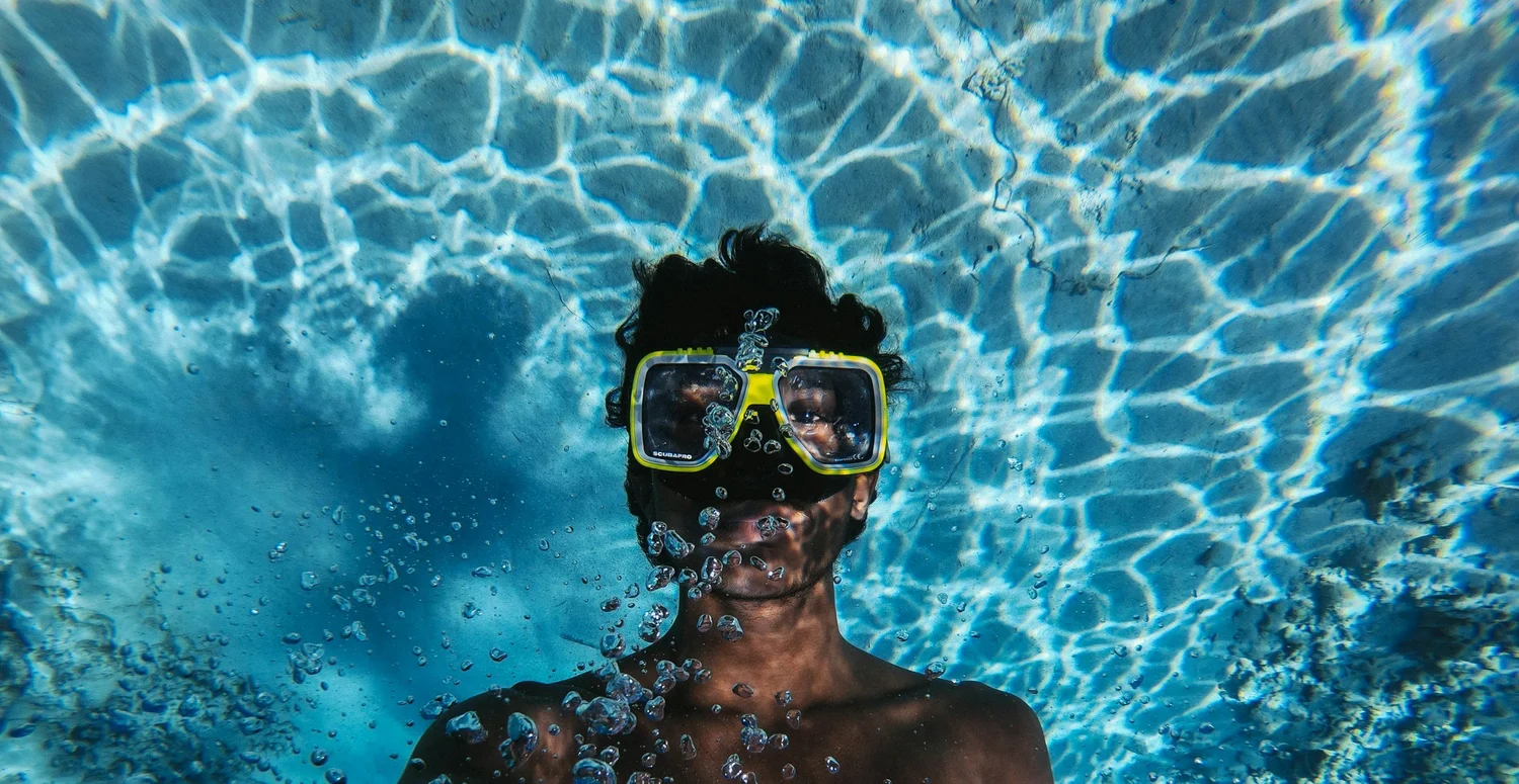 Diver looking up through the water