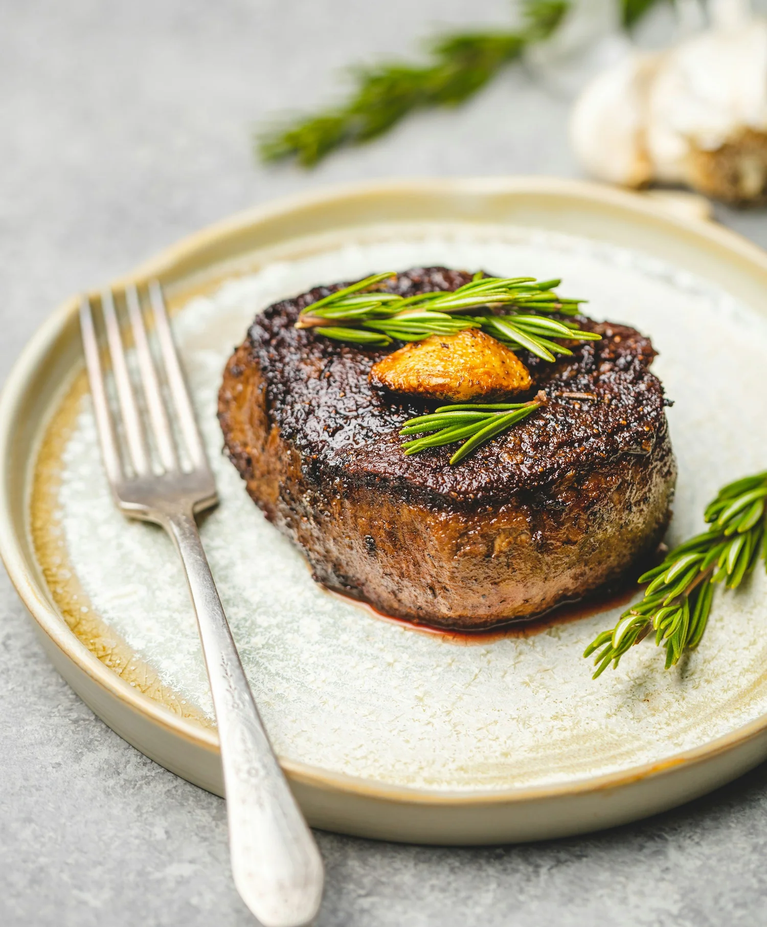Seared fillet with herbs on a ceramic plate