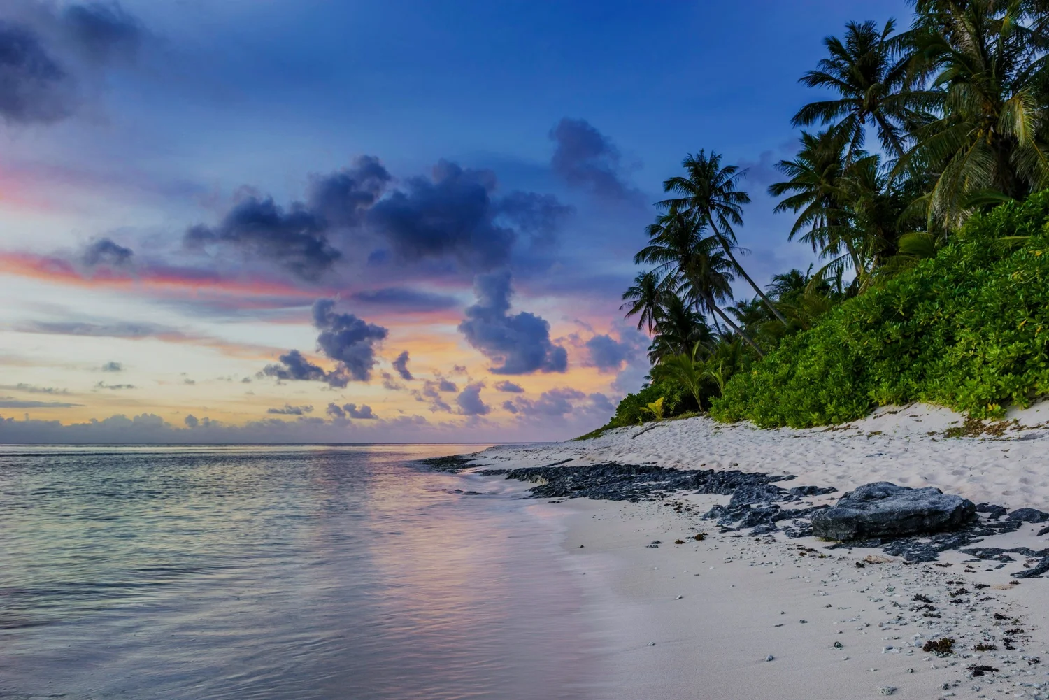 Pastel sunset over a quiet Andros beach